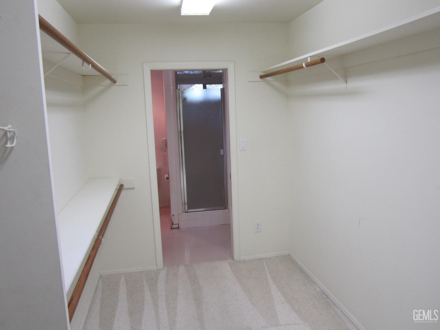 Undisclosed Address Bakersfield, CA 93314 - Photo 11 of 34 a view of an empty walk in closet