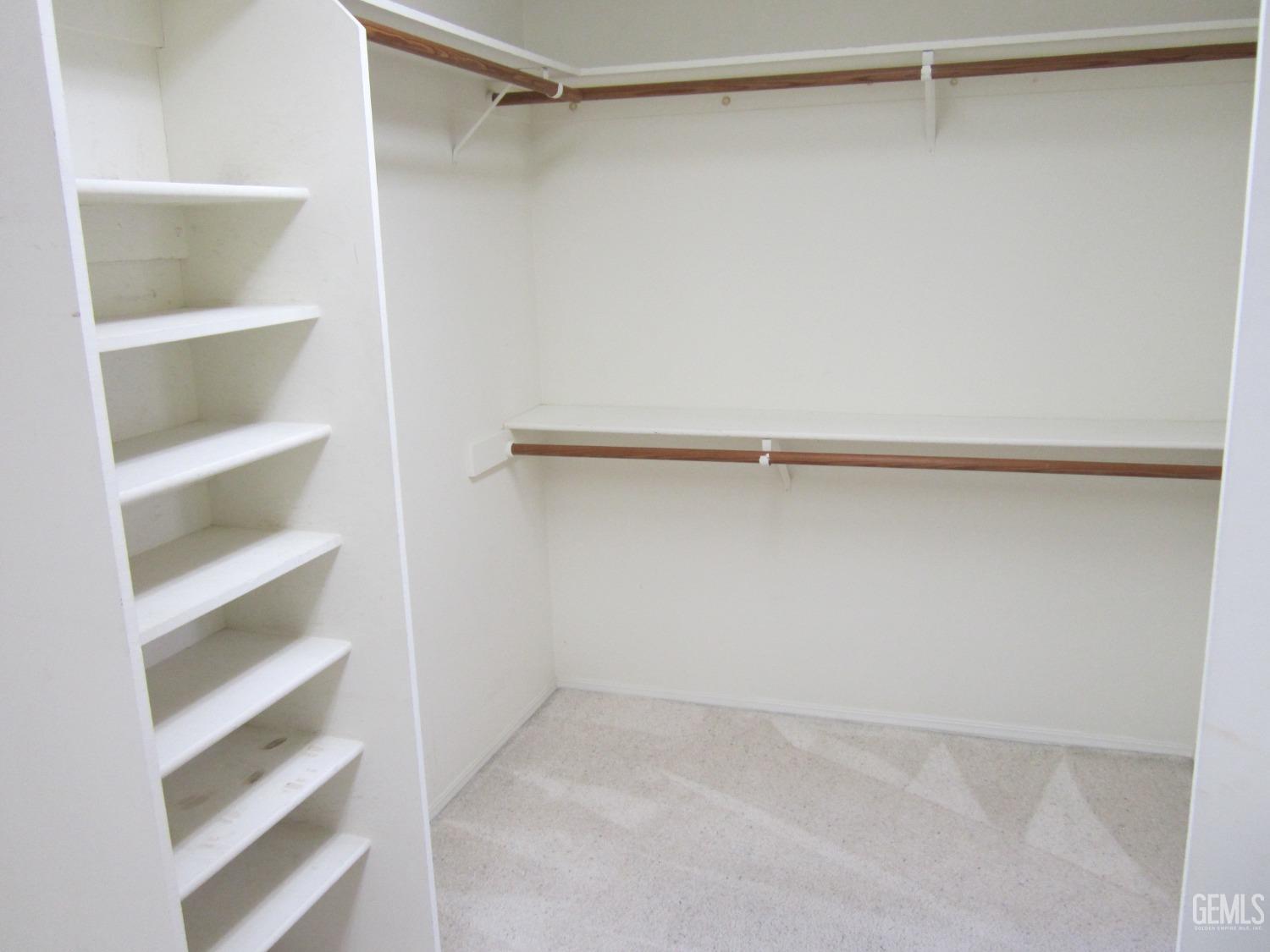 Undisclosed Address Bakersfield, CA 93314 - Photo 12 of 34 a view of an empty walk in closet