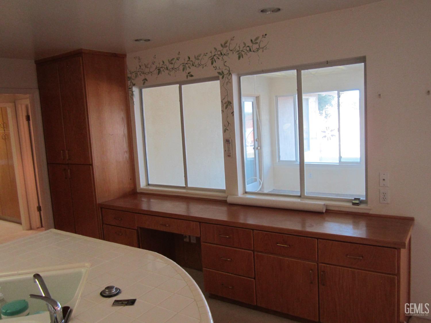Undisclosed Address Bakersfield, CA 93314 - Photo 21 of 34 a bathroom with a sink and a mirror
