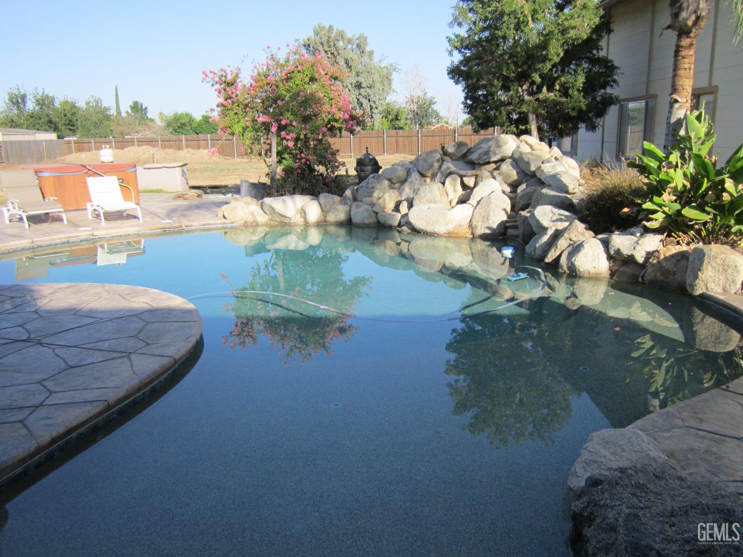 Undisclosed Address Bakersfield, CA 93314 - Photo 26 of 34 a view of a lake from a terrace