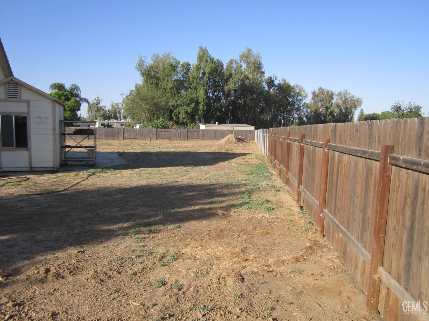 Undisclosed Address Bakersfield, CA 93314 - Photo 34 of 34 a view of backyard with swimming pool and seating area