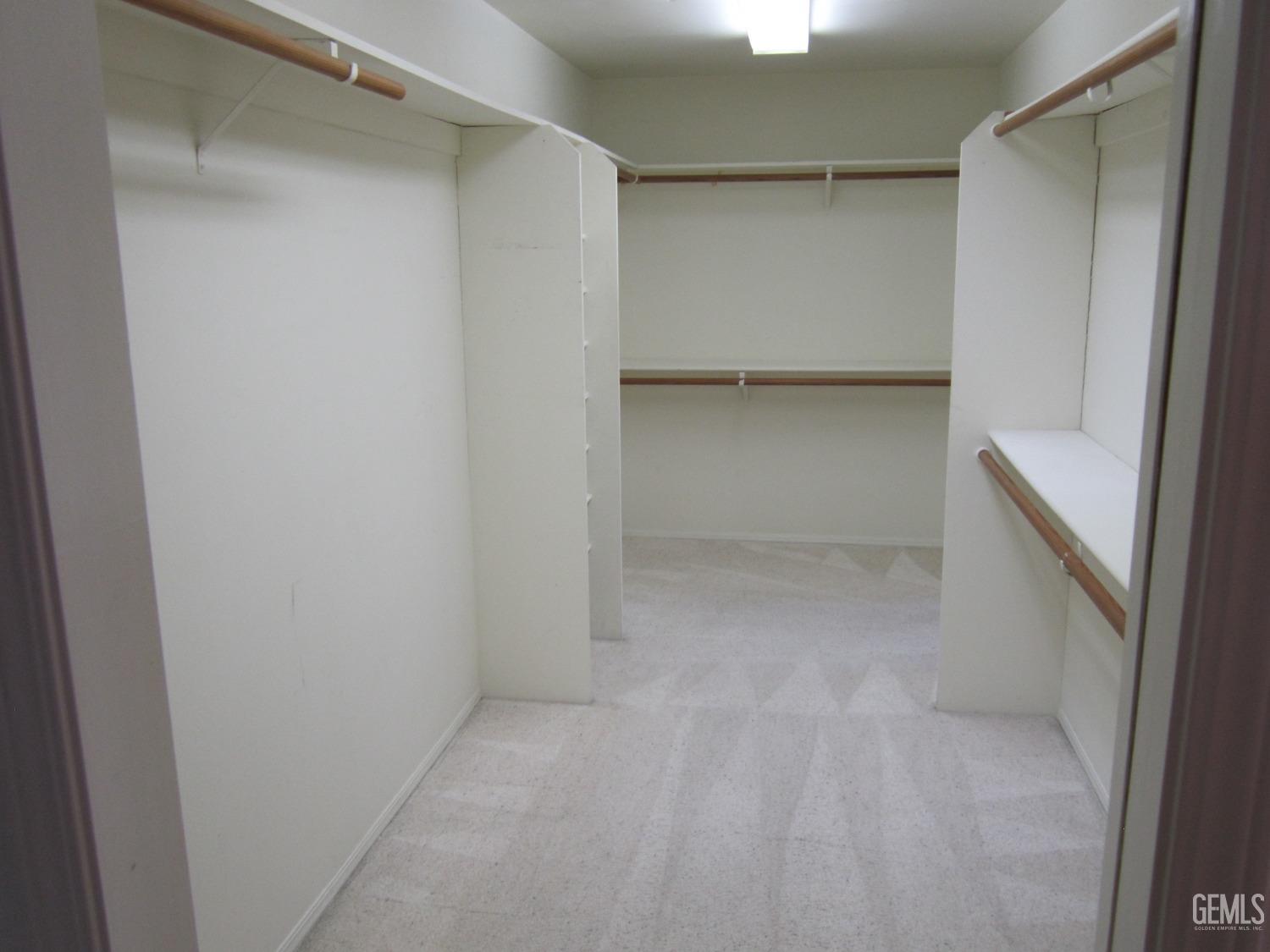 Undisclosed Address Bakersfield, CA 93314 - Photo 10 of 34 a view of an empty walk in closet
