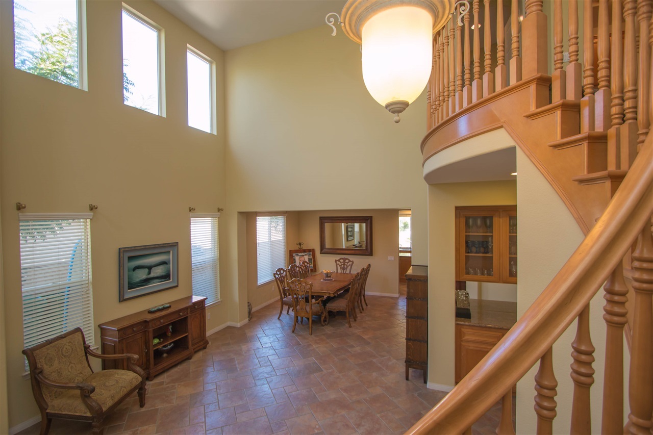 1243 Mariposa Road Carlsbad, CA 92011 - Photo 11 of 25 This shows the living room and dining room combination as taken from the stairs.