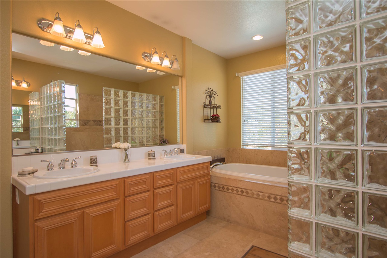 1243 Mariposa Road Carlsbad, CA 92011 - Photo 16 of 25 Another view of the master bath shows the dual sinks and plenty of storage.