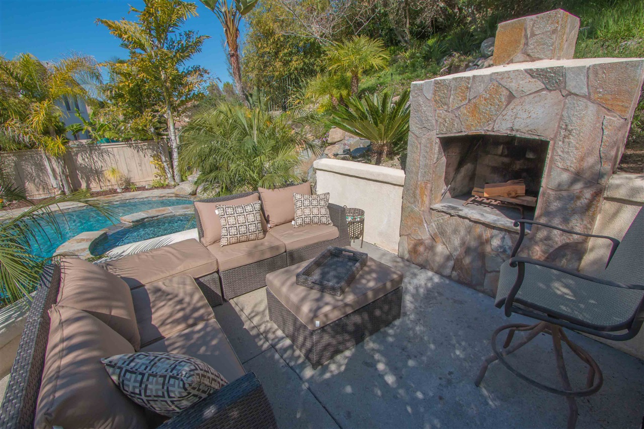 1243 Mariposa Road Carlsbad, CA 92011 - Photo 17 of 25 You'll love relaxing in this raised level patio with custom fireplace.
