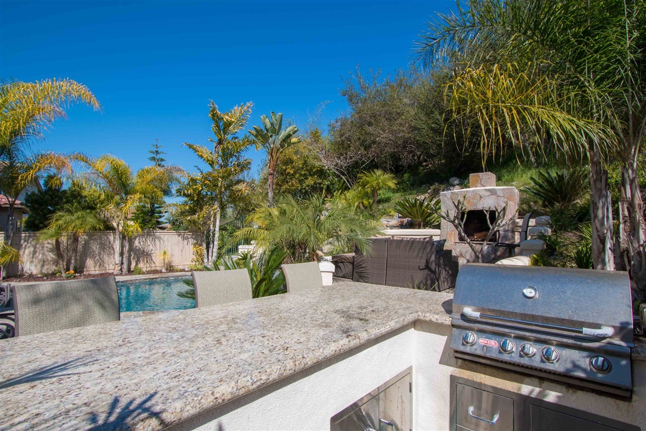 1243 Mariposa Road Carlsbad, CA 92011 - Photo 18 of 25 Built-in BBQ has eat-in bar with granite counters.