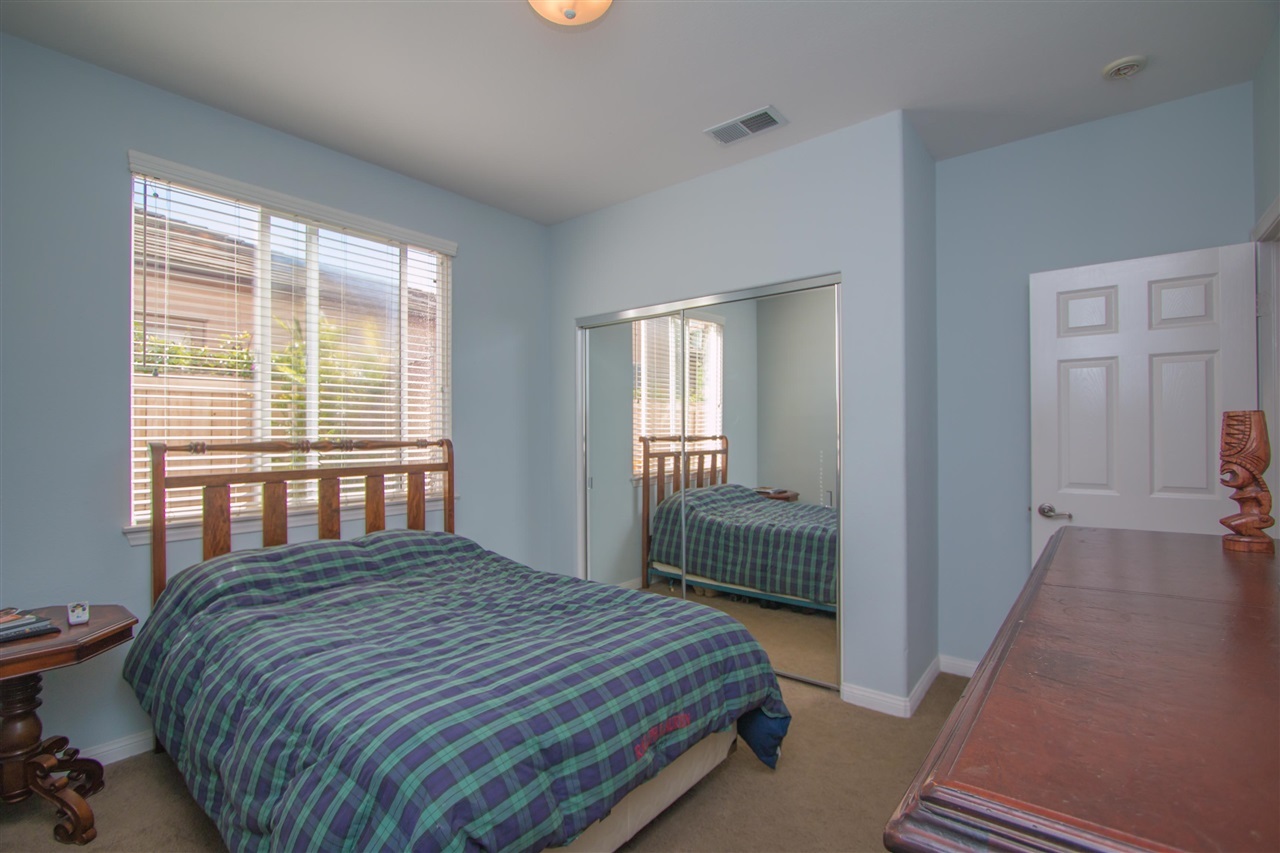 1243 Mariposa Road Carlsbad, CA 92011 - Photo 19 of 25 This is the first floor guest bedroom that has an adjacent full bath.