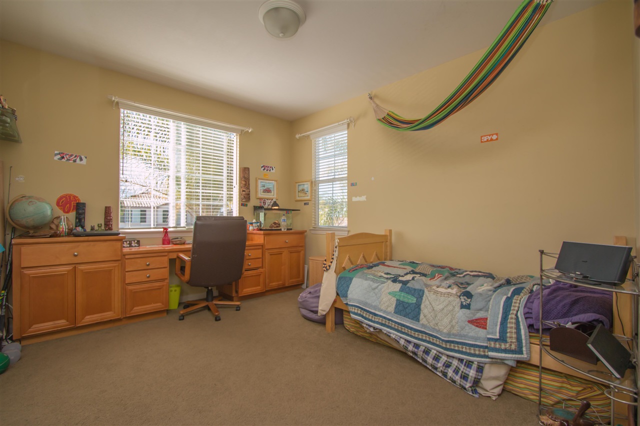 1243 Mariposa Road Carlsbad, CA 92011 - Photo 21 of 25 This bedroom has a built-in desk and its own private full bath.