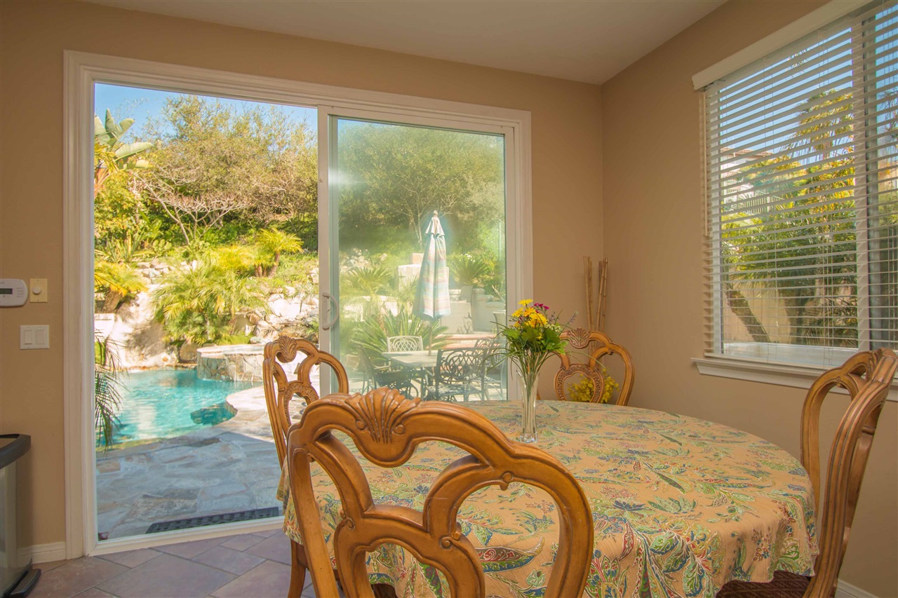 1243 Mariposa Road Carlsbad, CA 92011 - Photo 8 of 25 The eating area has sliding glass patio doors to the backyard!
