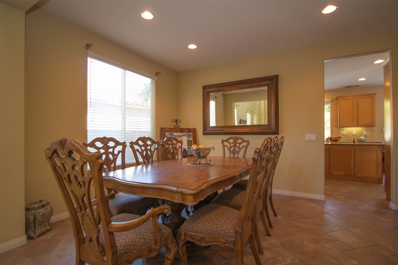 1243 Mariposa Road Carlsbad, CA 92011 - Photo 9 of 25 This view of the dining room shows off the custom paint and designer diagonal tile floors.