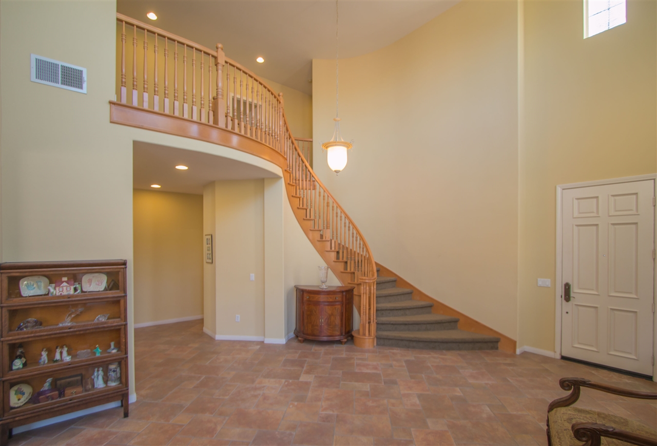 1243 Mariposa Road Carlsbad, CA 92011 - Photo 10 of 25 This shows the beautiful architecture of the home with high ceilings and sweeping staircase.