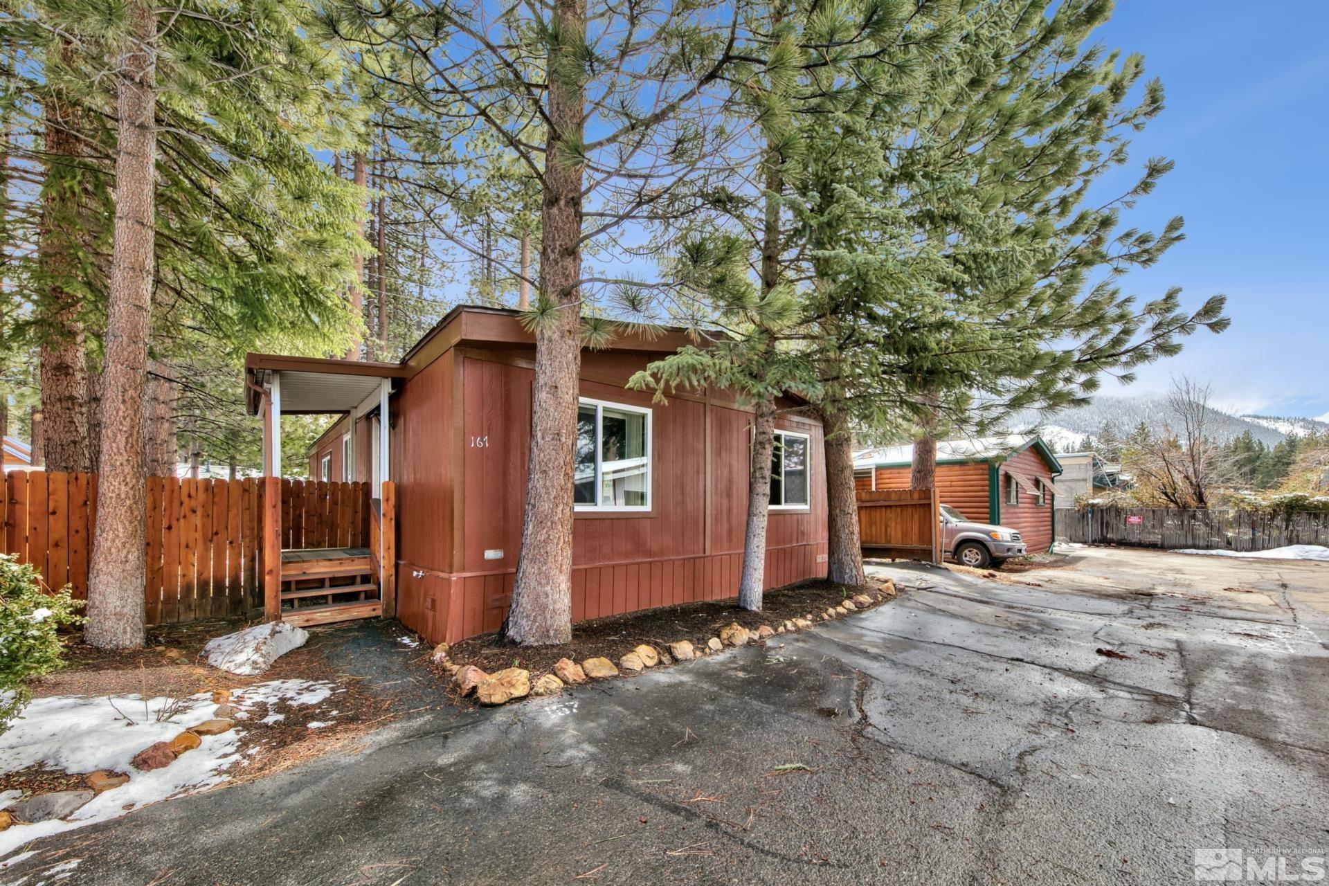167 Crescent Drive Stateline, NV 89449 - Photo 1 of 23 a view of a house with backyard and a tree