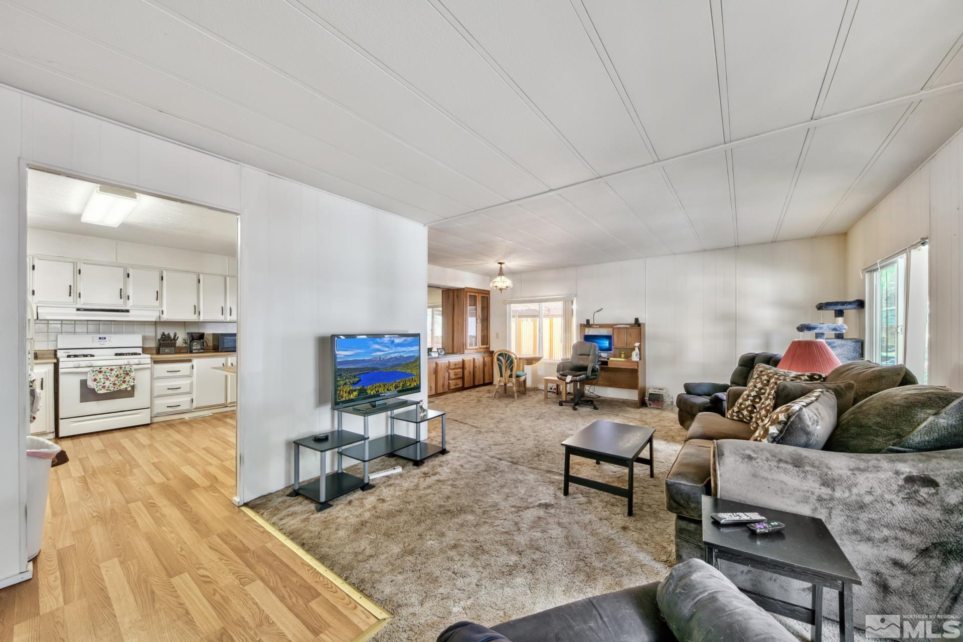 167 Crescent Drive Stateline, NV 89449 - Photo 11 of 23 a living room with furniture and a flat screen tv