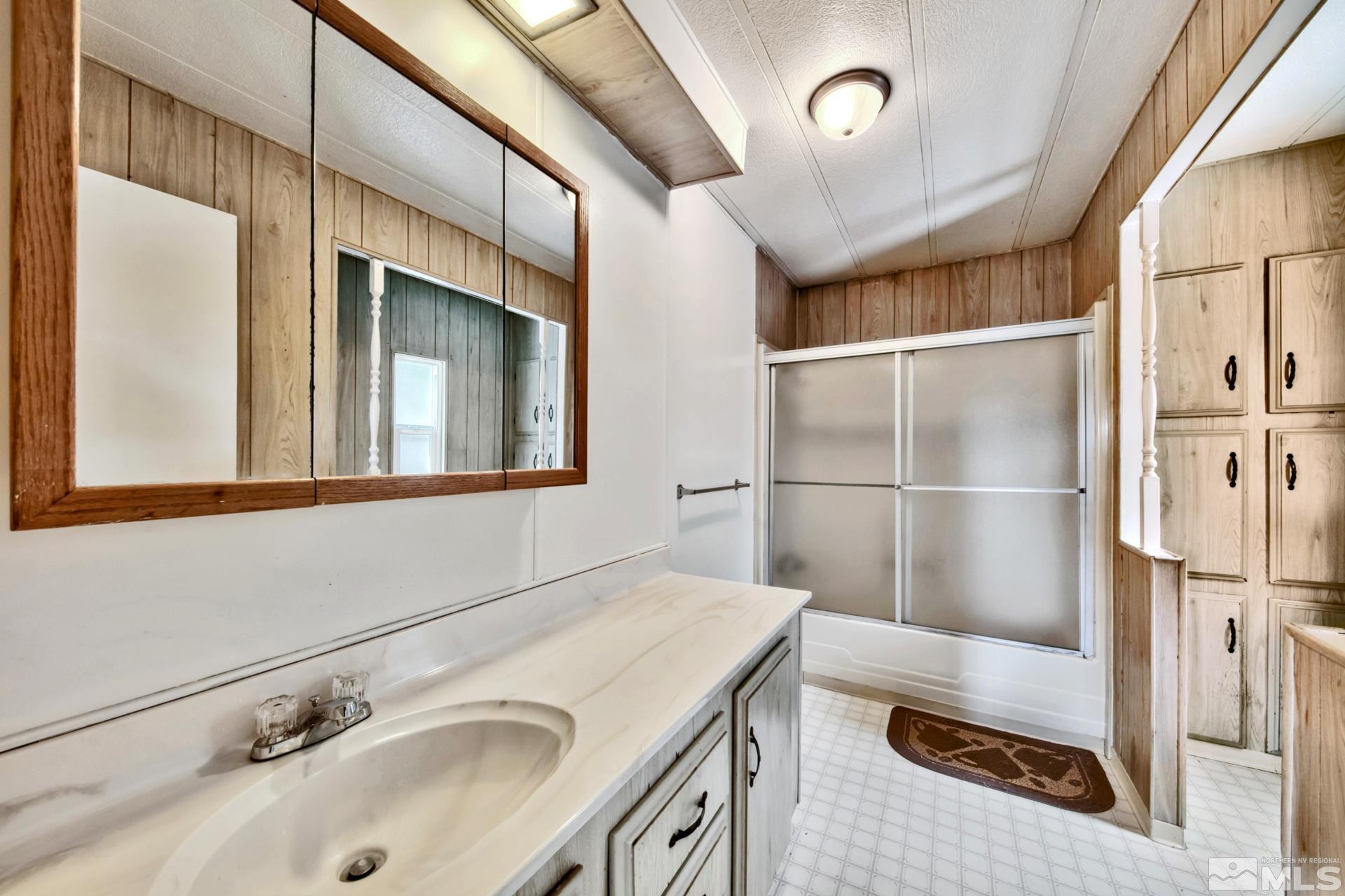 167 Crescent Drive Stateline, NV 89449 - Photo 14 of 23 a bathroom with a sink and a mirror