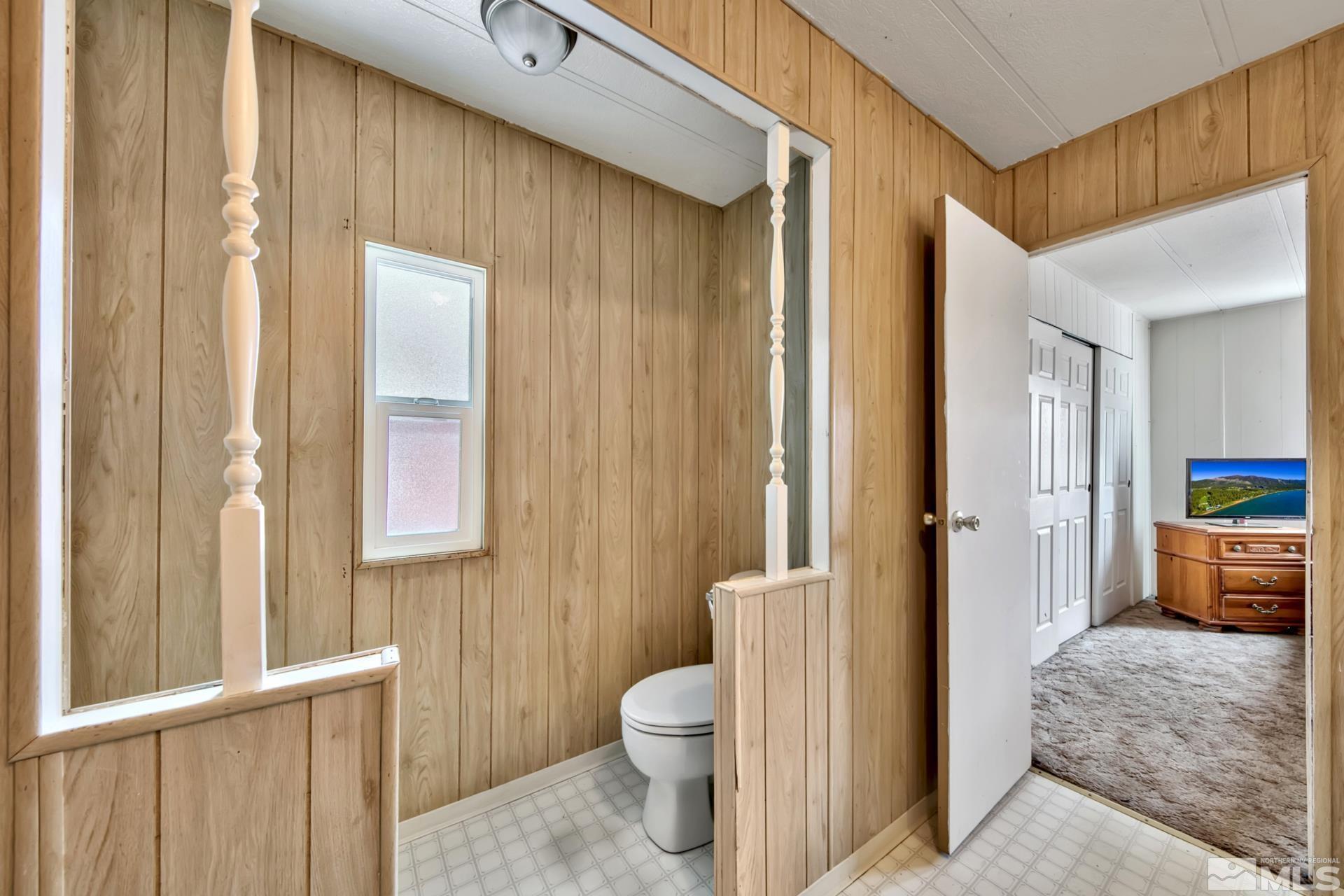 167 Crescent Drive Stateline, NV 89449 - Photo 15 of 23 a bathroom with a granite countertop sink toilet and shower