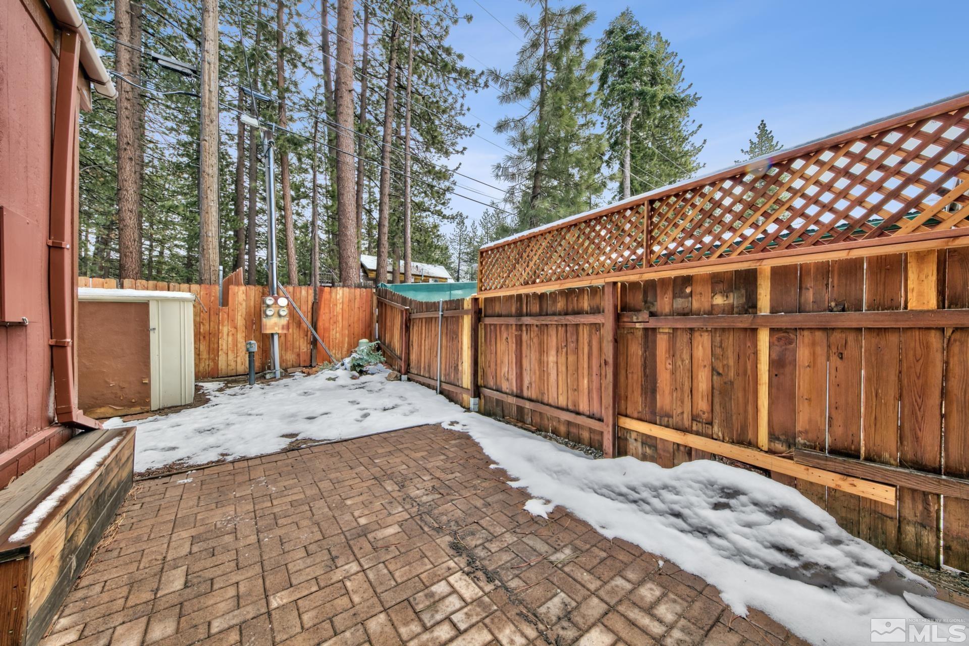 167 Crescent Drive Stateline, NV 89449 - Photo 18 of 23 a view of a backyard with wooden fence