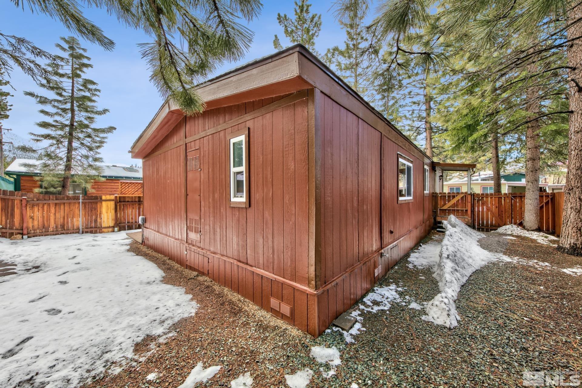 167 Crescent Drive Stateline, NV 89449 - Photo 19 of 23 a view of a house with a snow in the yard