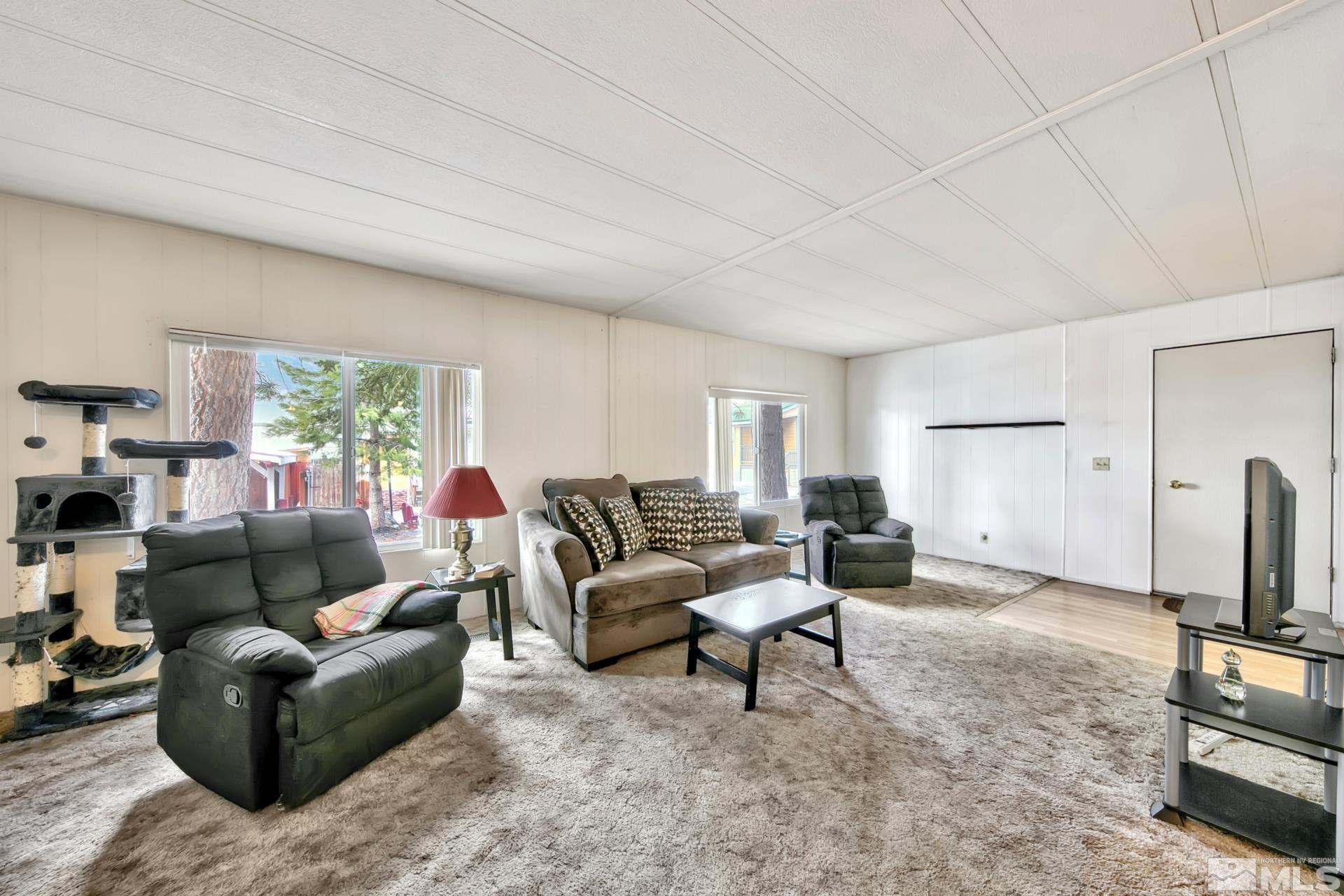 167 Crescent Drive Stateline, NV 89449 - Photo 7 of 23 a living room with furniture and a flat screen tv