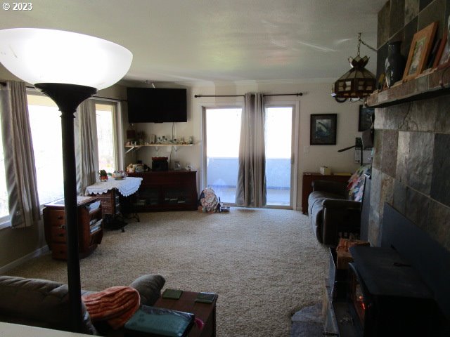 80452 Alston Mayger Road Clatskanie, OR 97016 - Photo 15 of 28 a living room with furniture and a fireplace