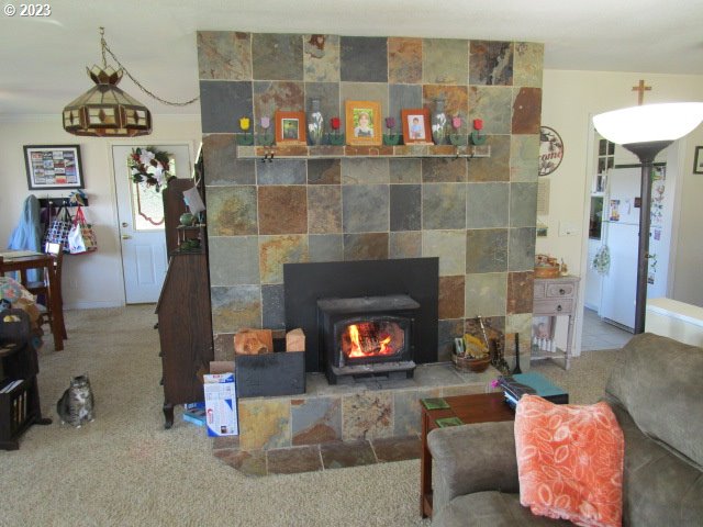 80452 Alston Mayger Road Clatskanie, OR 97016 - Photo 16 of 28 a living room with furniture and a fireplace
