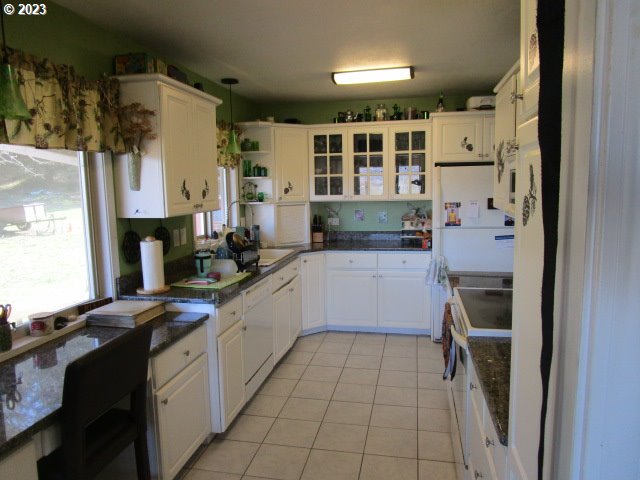 80452 Alston Mayger Road Clatskanie, OR 97016 - Photo 18 of 28 a kitchen with a sink and cabinets