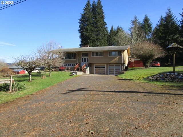 80452 Alston Mayger Road Clatskanie, OR 97016 - Photo 2 of 28 a view of house with a yard