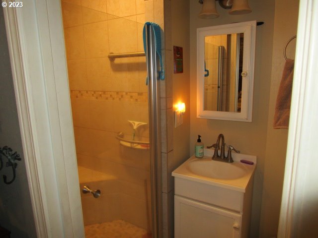 80452 Alston Mayger Road Clatskanie, OR 97016 - Photo 23 of 28 a bathroom with a sink and mirror