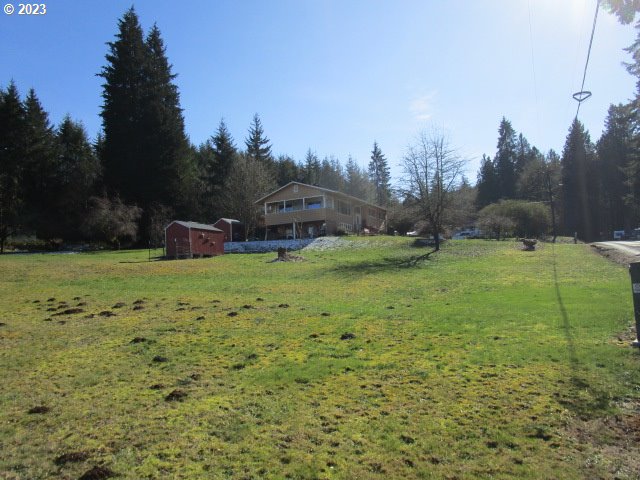 80452 Alston Mayger Road Clatskanie, OR 97016 - Photo 4 of 28 a view of a garden with a building in the background