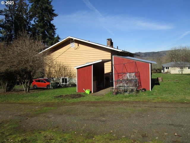 80452 Alston Mayger Road Clatskanie, OR 97016 - Photo 6 of 28 a view of a house with a yard and sitting area