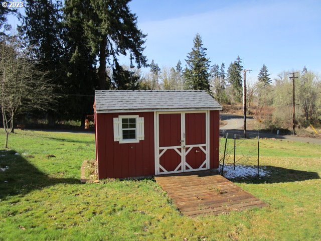 80452 Alston Mayger Road Clatskanie, OR 97016 - Photo 10 of 28 a backyard of a house with table and chairs