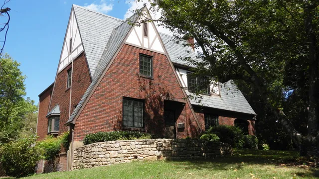 a view of house with yard and green space
