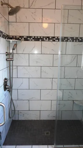 a white toilet sitting next to a window