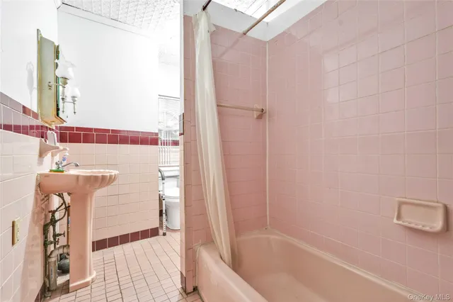 a bathroom with a bathtub and shower