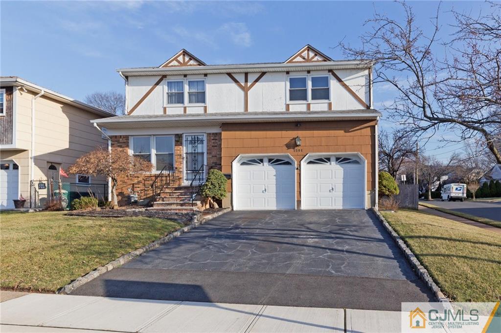 1591 Ridgeway Street Union, NJ 07083 - Photo 1 of 24 a front view of a house with a yard