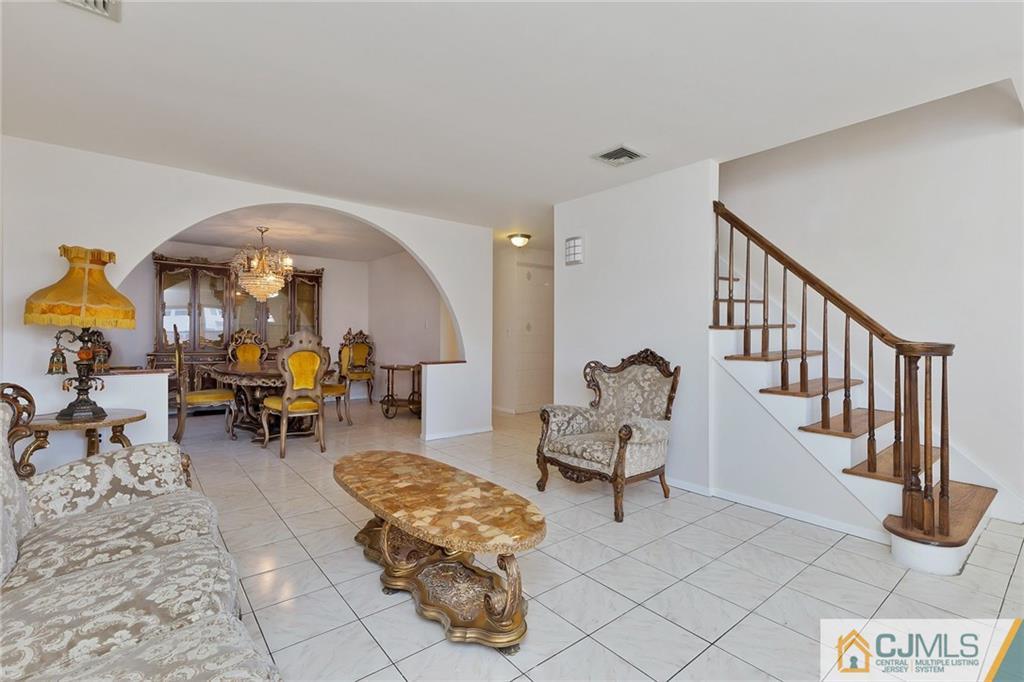 1591 Ridgeway Street Union, NJ 07083 - Photo 2 of 24 a living room with furniture and a chandelier