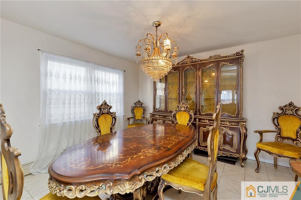 1591 Ridgeway Street Union, NJ 07083 - Photo 3 of 24 a dining room with furniture and chandelier