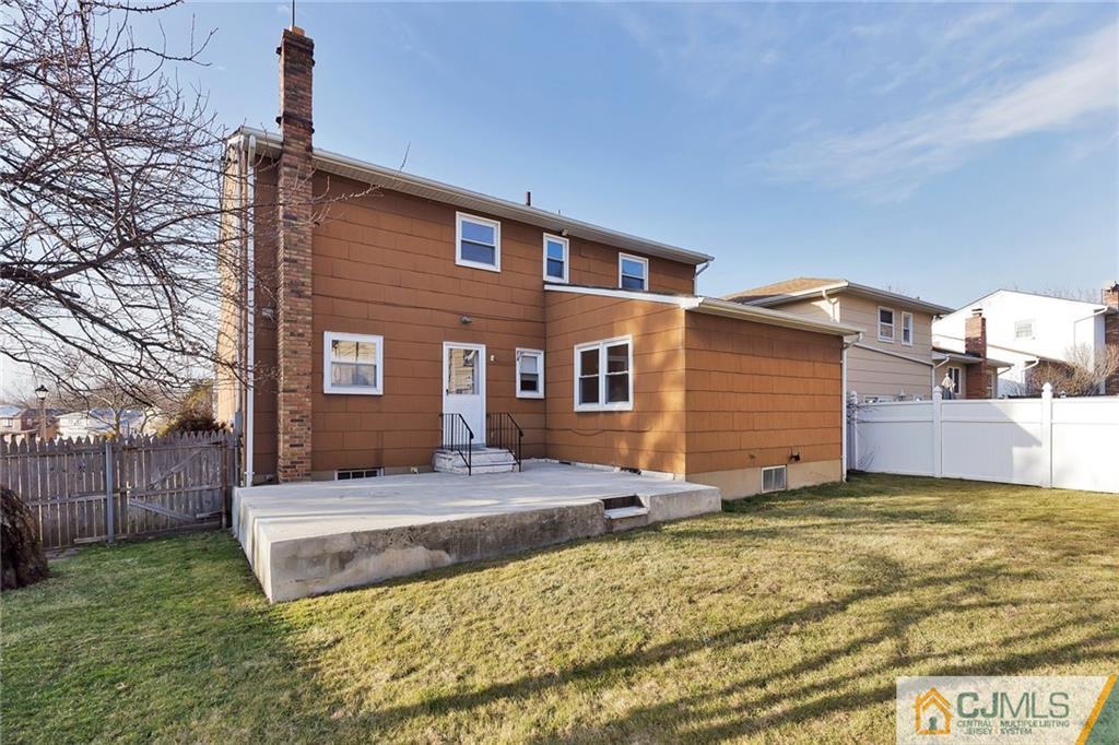 1591 Ridgeway Street Union, NJ 07083 - Photo 22 of 24 a front view of a house with a yard and garage