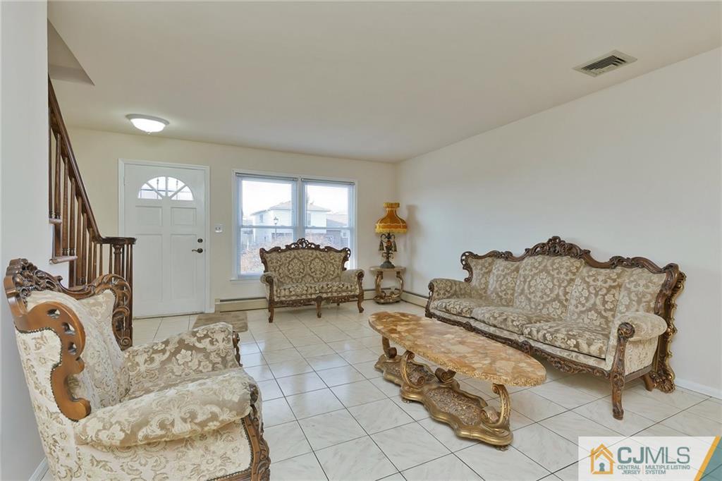 1591 Ridgeway Street Union, NJ 07083 - Photo 5 of 24 a living room with furniture and a large window
