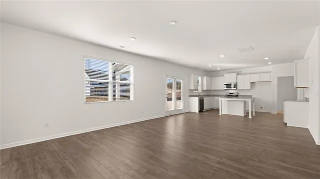 a view of kitchen with wooden floor