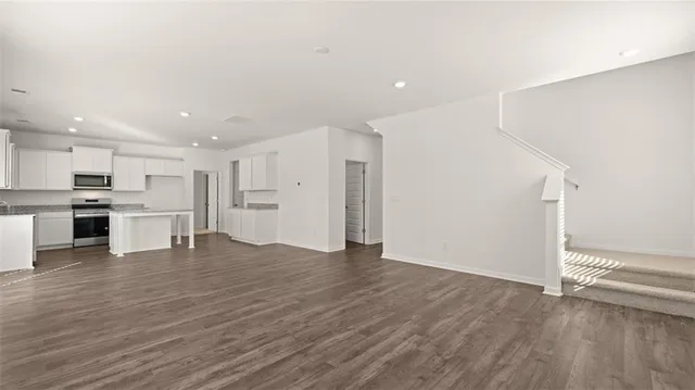 a bathroom with a sink toilet and a mirror