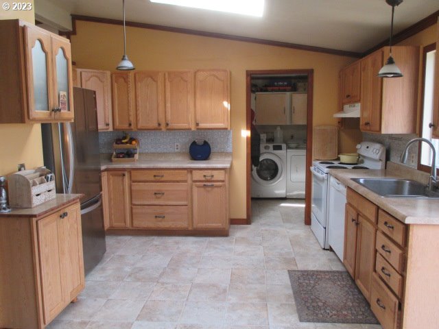 41380 Southwest Fort Hill Road Willamina, OR 97396 - Photo 17 of 31 a kitchen with stainless steel appliances a stove a sink and a refrigerator