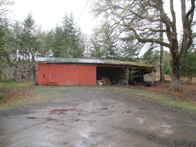 41380 Southwest Fort Hill Road Willamina, OR 97396 - Photo 3 of 31 a view of a house with a yard and garage