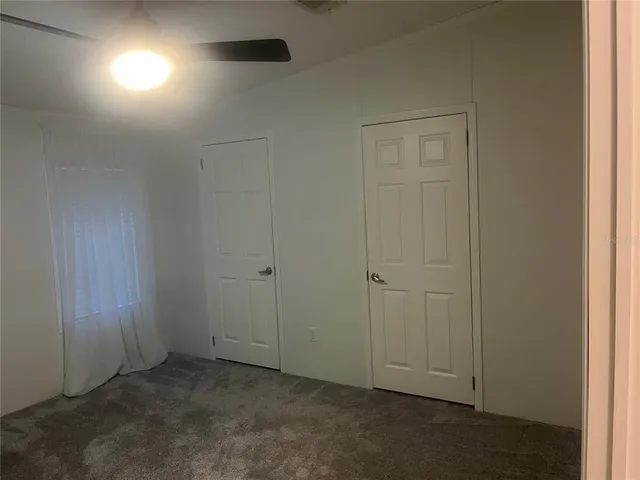 an empty room with closet area