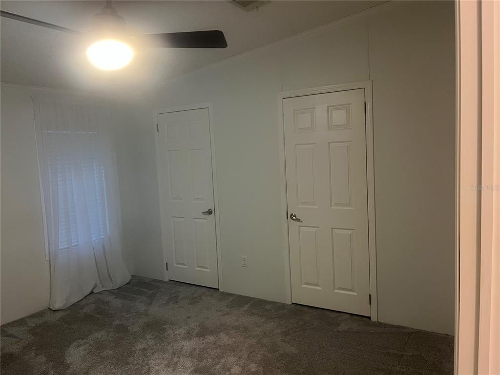 4064 Southwest 9th Way Okeechobee, FL 34974 - Photo 13 of 16 an empty room with closet area