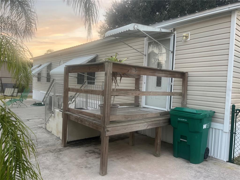 4064 Southwest 9th Way Okeechobee, FL 34974 - Photo 4 of 16 a view of a house with a window and wooden fence