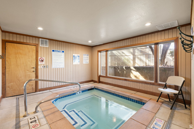 6852 Countrywoods Circle, Unit 5D Midvale, UT 84047 - Photo 44 of 50 Indoor spa featuring a tiled interior, stainless steel handrail, and integrated steps