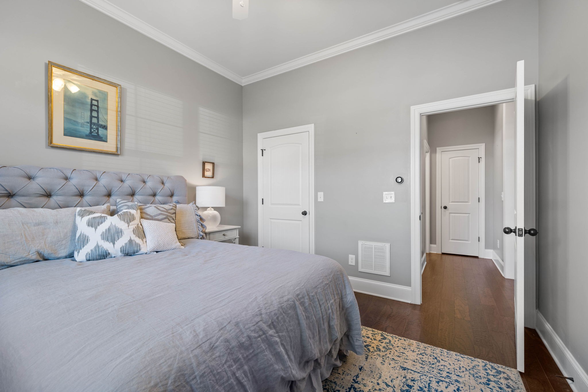 312 Cedar Street Lebanon, TN 37087 - Photo 31 of 69 a bedroom with a bed and a painting on the wall