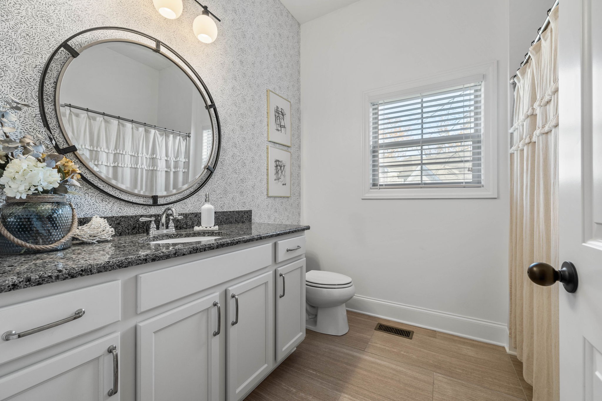 312 Cedar Street Lebanon, TN 37087 - Photo 32 of 69 a bathroom with a granite countertop toilet a sink and a mirror