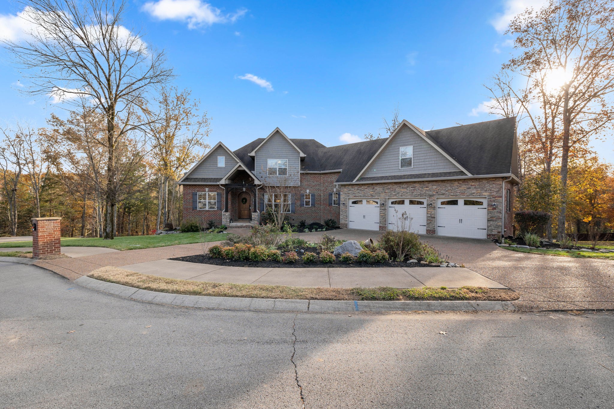 312 Cedar Street Lebanon, TN 37087 - Photo 66 of 69 a front view of a house with a yard and potted plants