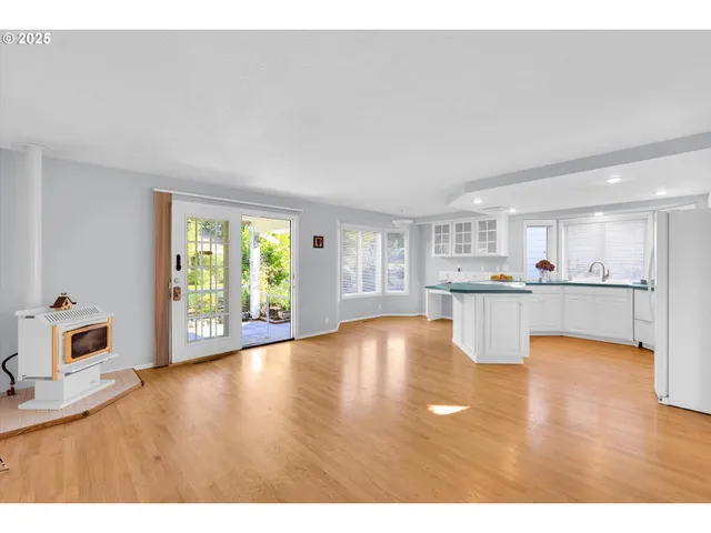 a view of kitchen with furniture and wooden floor